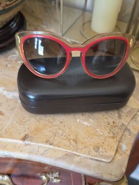 Authentic Louis Vuitton Red and Gold Cat Eye Willow Sunglasses with Dark Lenses.
